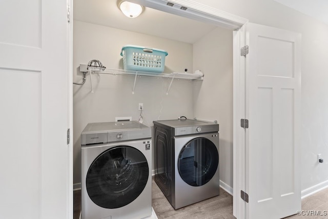16619 Jefferson Hwy, Bumpass, VA 23024 - laundry area with washing machine and dryer, light wood finished floors, and baseboards