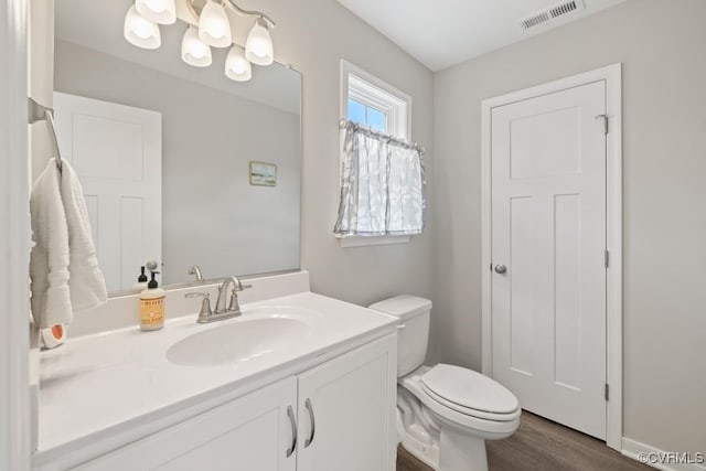 16619 Jefferson Hwy, Bumpass, VA 23024 - half bath with vanity, toilet, and wood finished floors
