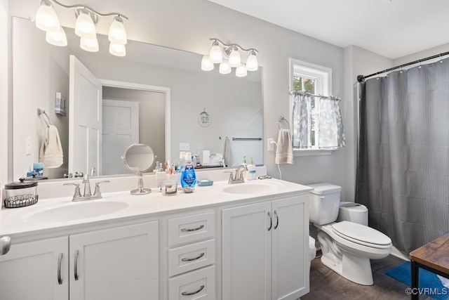 16619 Jefferson Hwy, Bumpass, VA 23024 - full bathroom with double vanity, toilet, wood finished floors, and a shower with shower curtain