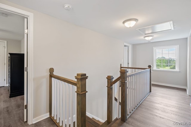 16619 Jefferson Hwy, Bumpass, VA 23024 - hall featuring an upstairs landing, wood finished floors, baseboards, and attic access