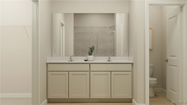 6641 Cassia Loop, Moseley, VA 23120 - bathroom with toilet, tiled shower, a closet, baseboards, and double vanity