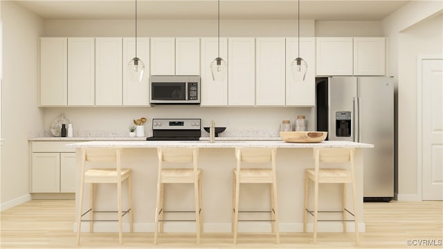 6641 Cassia Loop, Moseley, VA 23120 - kitchen with stainless steel appliances, light wood-style flooring, a kitchen island with sink, and a breakfast bar area
