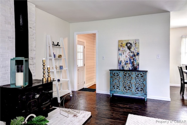 704 Athens Ave, Hampton, VA 23669 - living room with wood finished floors, a wood stove, and baseboards