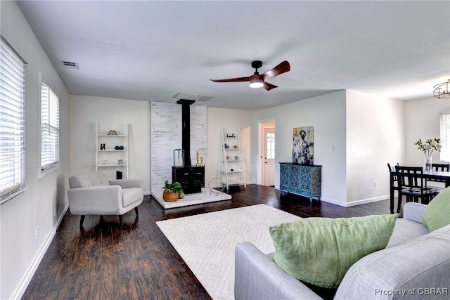 704 Athens Ave, Hampton, VA 23669 - living area featuring a wood stove, wood finished floors, and plenty of natural light