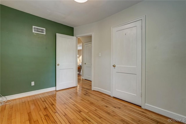7400 Westfield Rd, Henrico, VA 23226 - unfurnished bedroom featuring baseboards and light wood finished floors