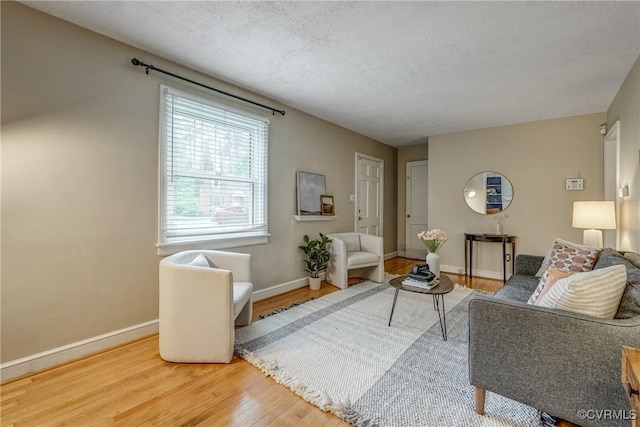 7400 Westfield Rd, Henrico, VA 23226 - living area featuring wood finished floors, baseboards, and a textured ceiling