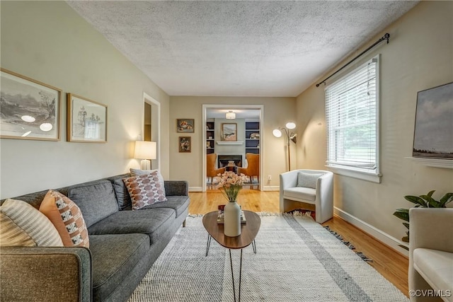 7400 Westfield Rd, Henrico, VA 23226 - living room featuring wood finished floors, a textured ceiling, and baseboards