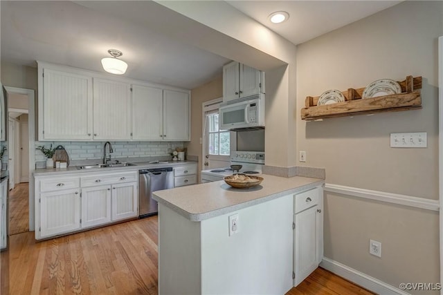 7400 Westfield Rd, Henrico, VA 23226 - kitchen with white appliances, a sink, light countertops, a peninsula, and open shelves