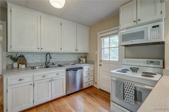 7400 Westfield Rd, Henrico, VA 23226 - kitchen featuring white appliances, a sink, light countertops, and backsplash