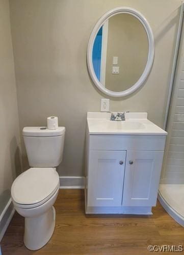 1217 Arlington St, Petersburg, VA 23803 - bathroom with vanity, wood finished floors, and a shower