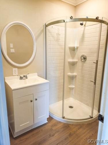 1217 Arlington St, Petersburg, VA 23803 - full bath with a shower stall, wood finished floors, vanity, and crown molding
