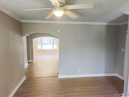 1217 Arlington St, Petersburg, VA 23803 - spare room with arched walkways, wood finished floors, ornamental molding, and a ceiling fan