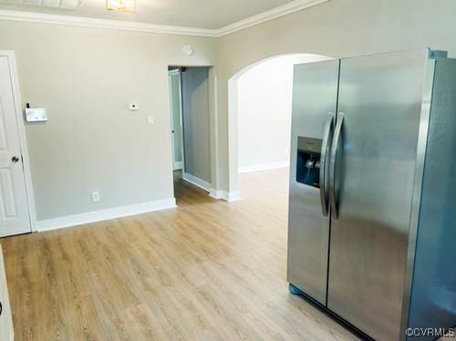 1217 Arlington St, Petersburg, VA 23803 - kitchen with stainless steel fridge, arched walkways, ornamental molding, and light wood-style floors