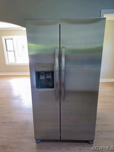 1217 Arlington St, Petersburg, VA 23803 - kitchen view of stainless steel refrigerator with ice dispenser and wood finished floors