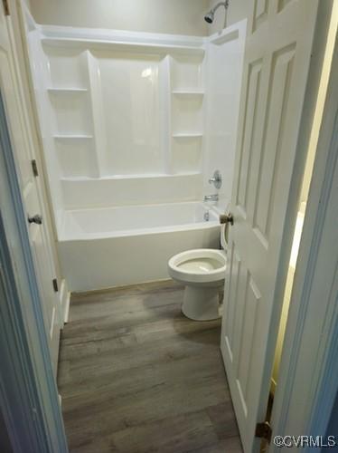 1217 Arlington St, Petersburg, VA 23803 - bathroom with wood finished floors and shower / bath combination