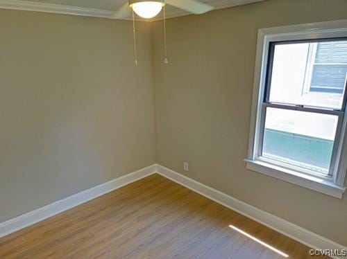 1217 Arlington St, Petersburg, VA 23803 - spare room featuring wood finished floors, ceiling fan, and crown molding