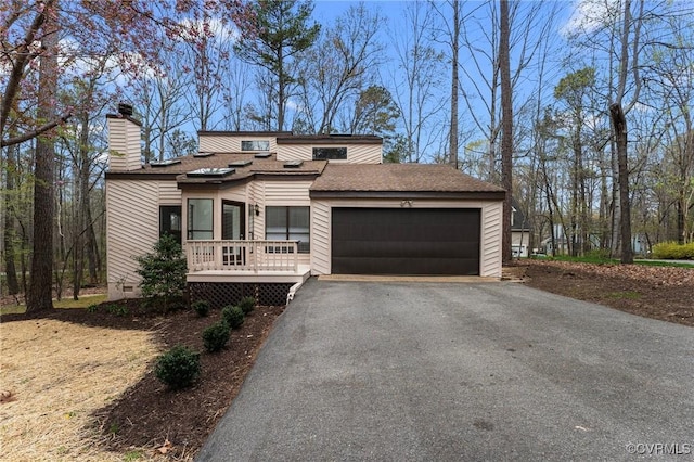 14323 Spring Gate Ct, Chesterfield, VA 23112 - view of front of home featuring a garage, a chimney, and driveway