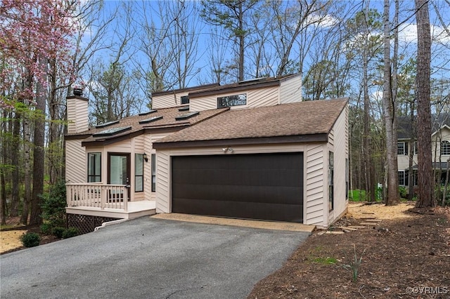 14323 Spring Gate Ct, Chesterfield, VA 23112 - view of front of home featuring a shingled roof, a chimney, an attached garage, driveway, and a deck