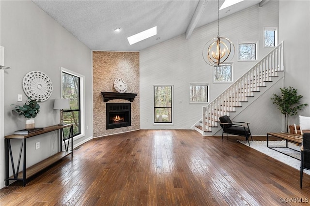 14323 Spring Gate Ct, Chesterfield, VA 23112 - living room featuring a skylight, high vaulted ceiling, plenty of natural light, stairs, and hardwood / wood-style floors