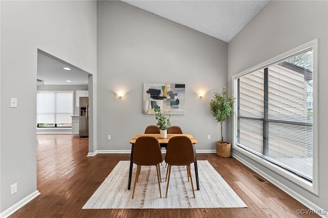 14323 Spring Gate Ct, Chesterfield, VA 23112 - dining area featuring baseboards, high vaulted ceiling, and dark wood-style flooring