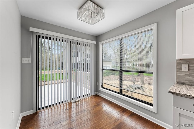 14323 Spring Gate Ct, Chesterfield, VA 23112 - unfurnished dining area with baseboards and dark wood finished floors