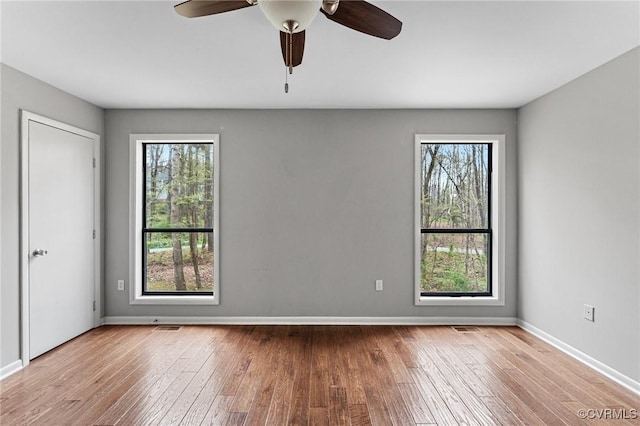 14323 Spring Gate Ct, Chesterfield, VA 23112 - empty room featuring plenty of natural light, hardwood / wood-style floors, and baseboards