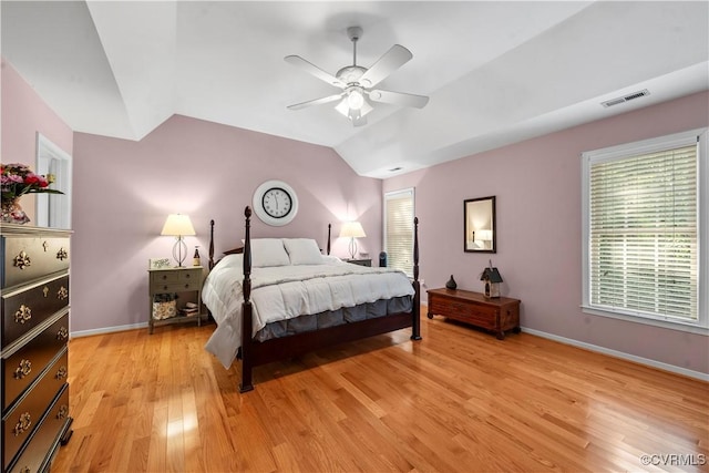 5158 Keitts Corner Rd, Mechanicsville, VA 23111 - bedroom with light wood-style floors, multiple windows, vaulted ceiling, and a ceiling fan