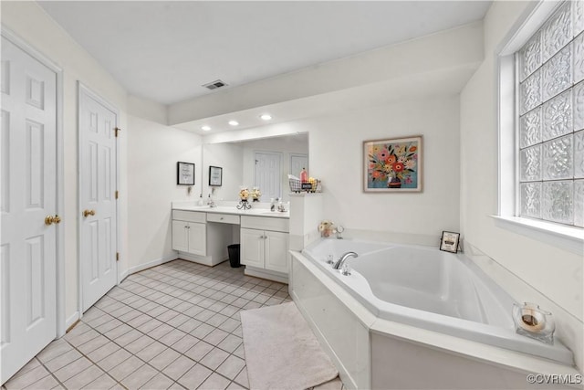 5158 Keitts Corner Rd, Mechanicsville, VA 23111 - bathroom with double vanity, a garden tub, plenty of natural light, recessed lighting, and tile patterned floors