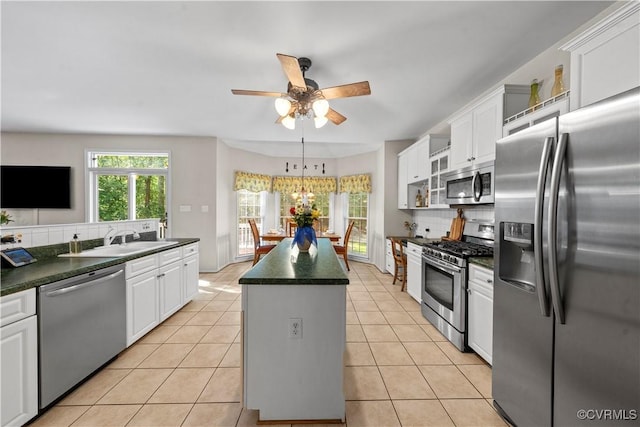5158 Keitts Corner Rd, Mechanicsville, VA 23111 - kitchen featuring stainless steel appliances, a kitchen island, dark countertops, and ceiling fan