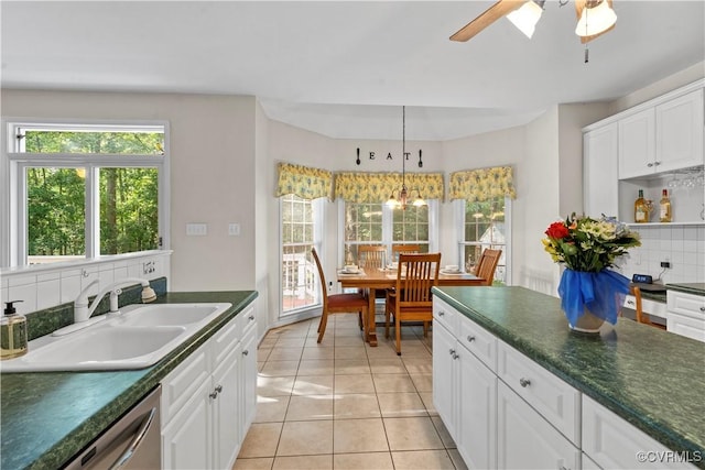 5158 Keitts Corner Rd, Mechanicsville, VA 23111 - kitchen featuring dark countertops, stainless steel dishwasher, tasteful backsplash, and ceiling fan