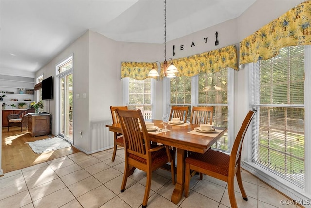 5158 Keitts Corner Rd, Mechanicsville, VA 23111 - dining room with light tile patterned floors and a chandelier
