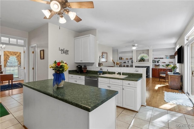 5158 Keitts Corner Rd, Mechanicsville, VA 23111 - kitchen with ceiling fan, a peninsula, light tile patterned floors, and dark countertops