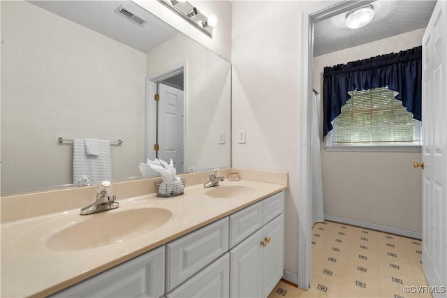 5158 Keitts Corner Rd, Mechanicsville, VA 23111 - bathroom with double vanity and tile patterned floors