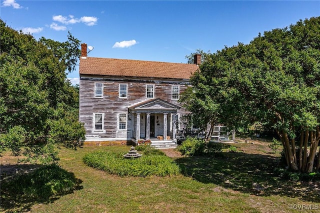 583 Slabtown Rd, Lancaster, VA 22503 - view of front facade featuring a chimney and a front lawn