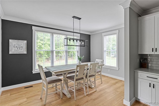 16319 Aklers Pl, Moseley, VA 23832 - dining room featuring crown molding, light wood-style floors, baseboards, and a chandelier