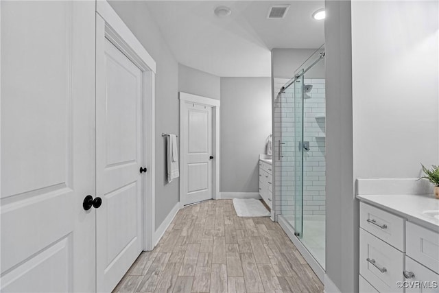 16319 Aklers Pl, Moseley, VA 23832 - full bathroom with vanity, a stall shower, and wood finished floors