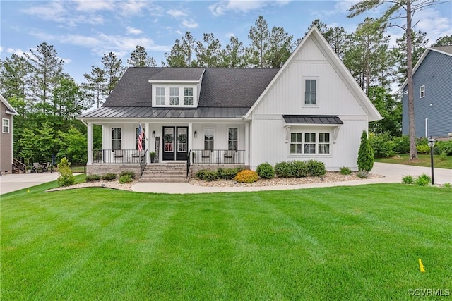 16319 Aklers Pl, Moseley, VA 23832 - modern inspired farmhouse featuring a standing seam roof, covered porch, metal roof, a front yard, and roof with shingles