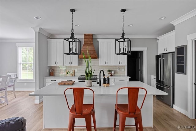 16319 Aklers Pl, Moseley, VA 23832 - kitchen with appliances with stainless steel finishes, premium range hood, ornamental molding, backsplash, and light countertops
