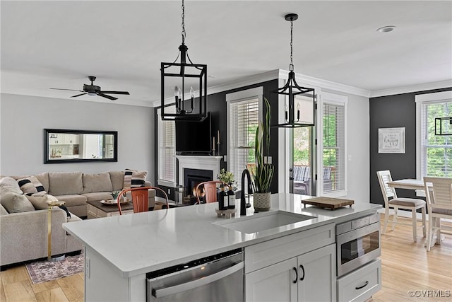 16319 Aklers Pl, Moseley, VA 23832 - kitchen featuring stainless steel appliances, a sink, open floor plan, pendant lighting, and crown molding