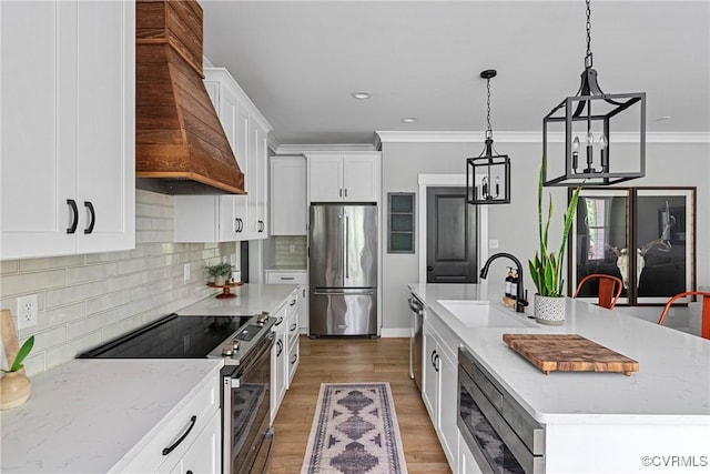 16319 Aklers Pl, Moseley, VA 23832 - kitchen featuring stainless steel appliances, a sink, ornamental molding, white cabinetry, and premium range hood