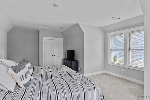 16319 Aklers Pl, Moseley, VA 23832 - carpeted bedroom featuring vaulted ceiling, baseboards, and a closet