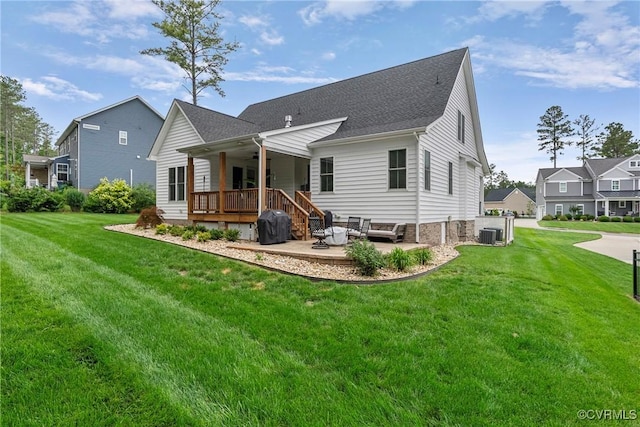 16319 Aklers Pl, Moseley, VA 23832 - rear view of house with ceiling fan, a lawn, a patio area, and roof with shingles