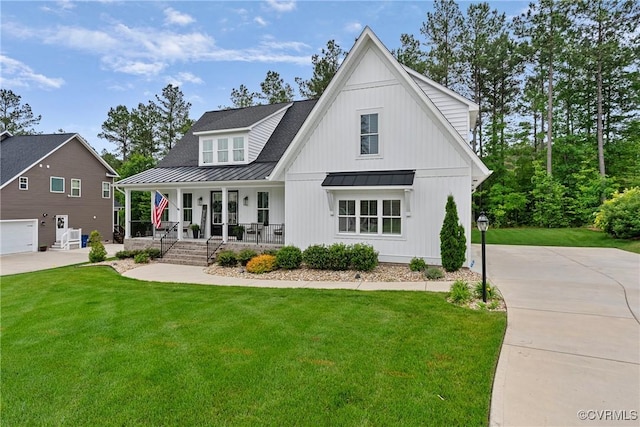 16319 Aklers Pl, Moseley, VA 23832 - view of front facade featuring a standing seam roof, a porch, a front yard, and metal roof
