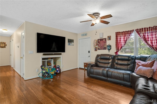 24390 Genito Rd, Amelia Courthouse, VA 23002 - living area with a ceiling fan, wood finished floors, a textured ceiling, and baseboards