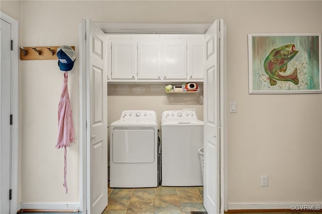 24390 Genito Rd, Amelia Courthouse, VA 23002 - washroom with independent washer and dryer, cabinet space, and stone finish flooring