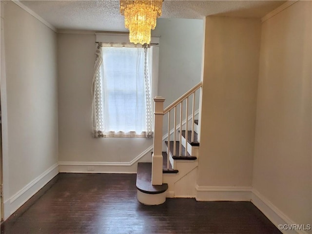 5308 Parker St, Richmond, VA 23231 - stairway with a chandelier, wood finished floors, a textured ceiling, baseboards, and crown molding