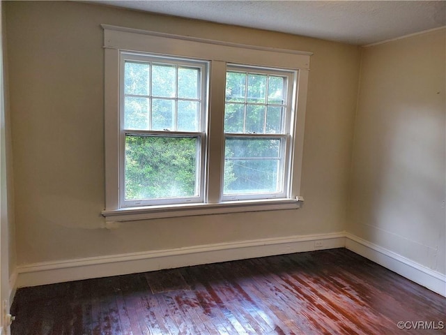 5308 Parker St, Richmond, VA 23231 - empty room featuring plenty of natural light, wood finished floors, and baseboards