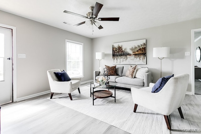 14560 Lodore Rd, Amelia Courthouse, VA 23002 - living area with light wood-style flooring, a ceiling fan, and baseboards