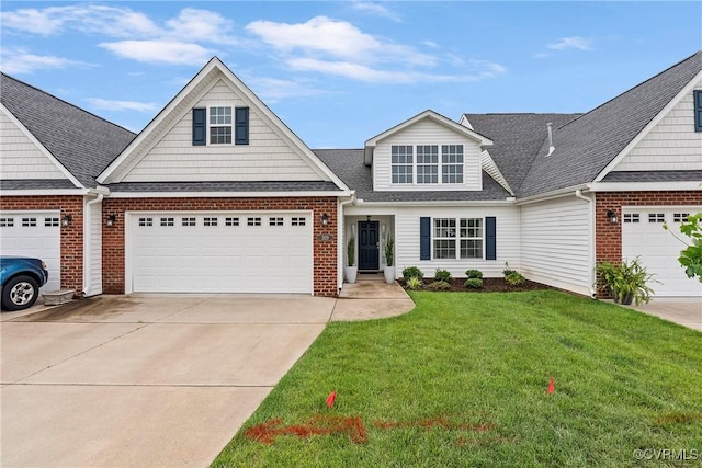 319 Wendenburg Ter, King William, VA 23009 - traditional-style home with driveway, a front yard, a garage, and brick siding