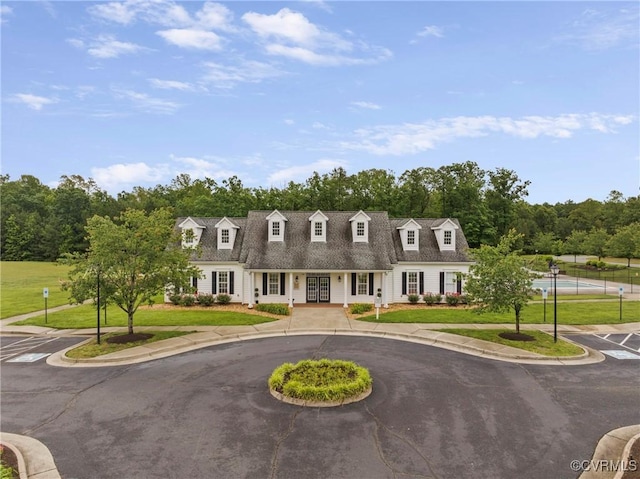 319 Wendenburg Ter, King William, VA 23009 - cape cod home featuring a front yard, a porch, and view of wooded area